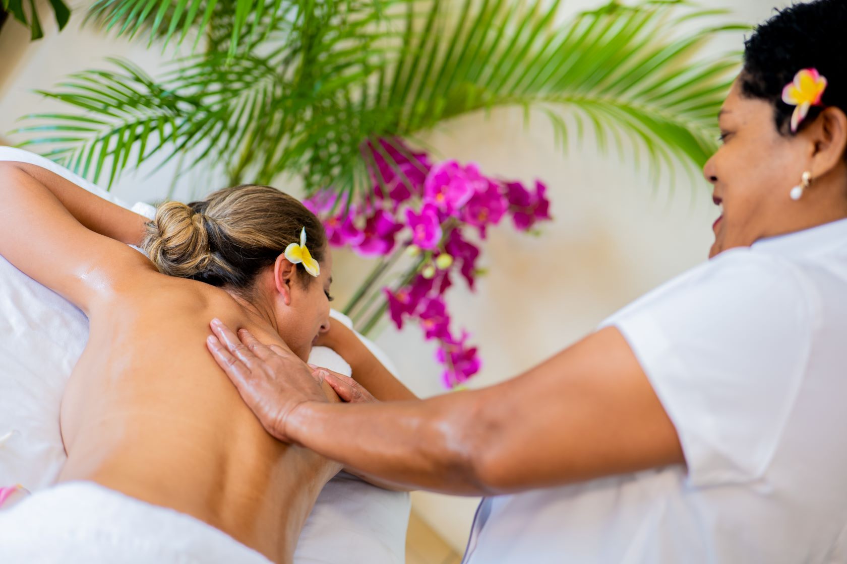 Indulge in a rejuvenating spa massage at Edgewater Resort, surrounded by tropical tranquility and island serenity.